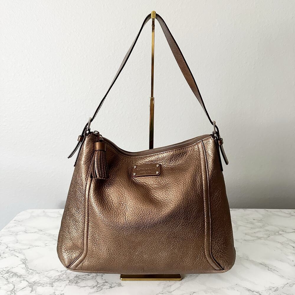 47. Kate Spade Shimmery Bronze Metallic Pebbled Leather Hobo Shoulder Bag Tassel